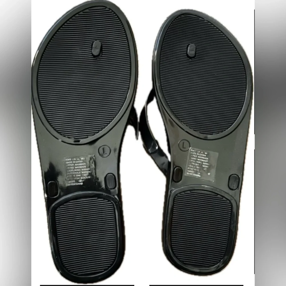 Tek Gear black and white flip flops. New with tag. Women’s size L (9-10)